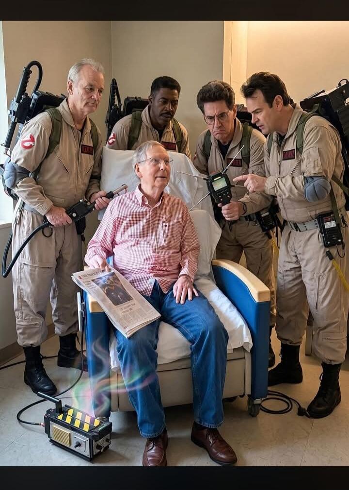The original Ghostbusters cast members (Bill Murray, Ernie Hudson, Dan Aykroyd, and a tribute to Harold Ramis) are gathered around an elderly man in a hospital chair. They are in their iconic uniforms with proton packs and ghost-detecting equipment. A ghost trap on the floor emits colorful energy, suggesting a playful ghost-hunting scenario. The el