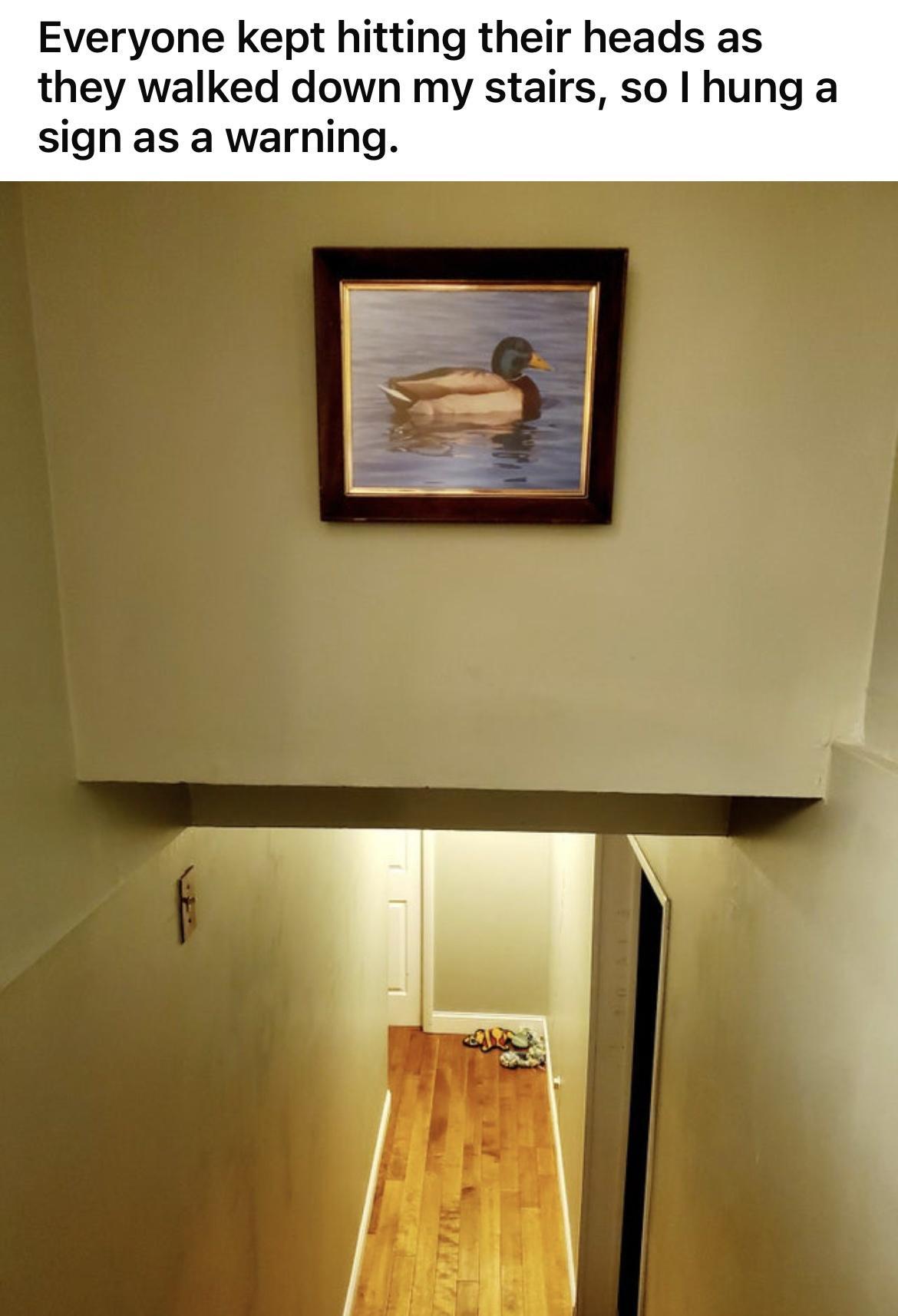 Everyone kept hitting their heads as they walked down my stairs so hung a sign as a warning