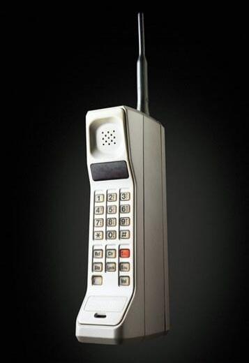 Old brick mobile phone with a long antenna