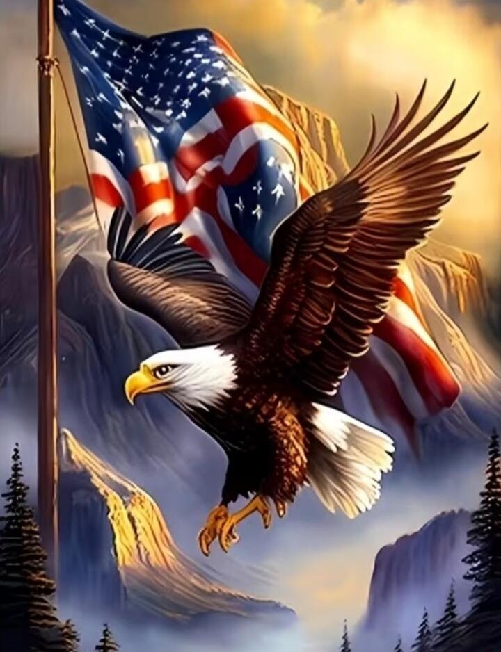 A bald eagle with outstretched wings soars in front of a waving American flag against a mountainous landscape.