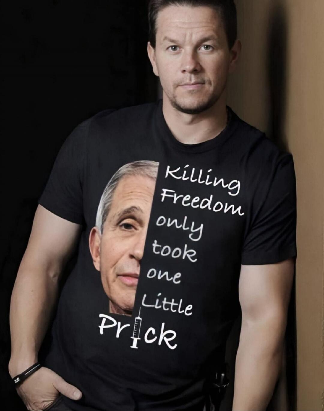 Mark Wahlberg wearing a black t-shirt with a split image of Anthony Fauci's face and the text 'Killing Freedom only took one Little Prick', where 'i' in 'Prick' is replaced by a syringe icon.