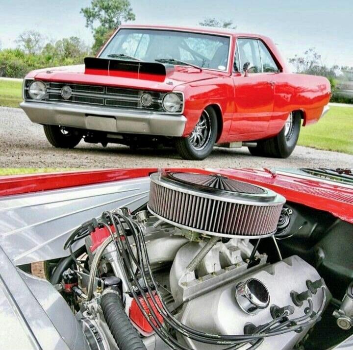 Image shows a red classic car with an exposed engine and large circular air filter.