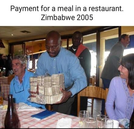 Payment for a meal in a restaurant. Zimbabwe 2005