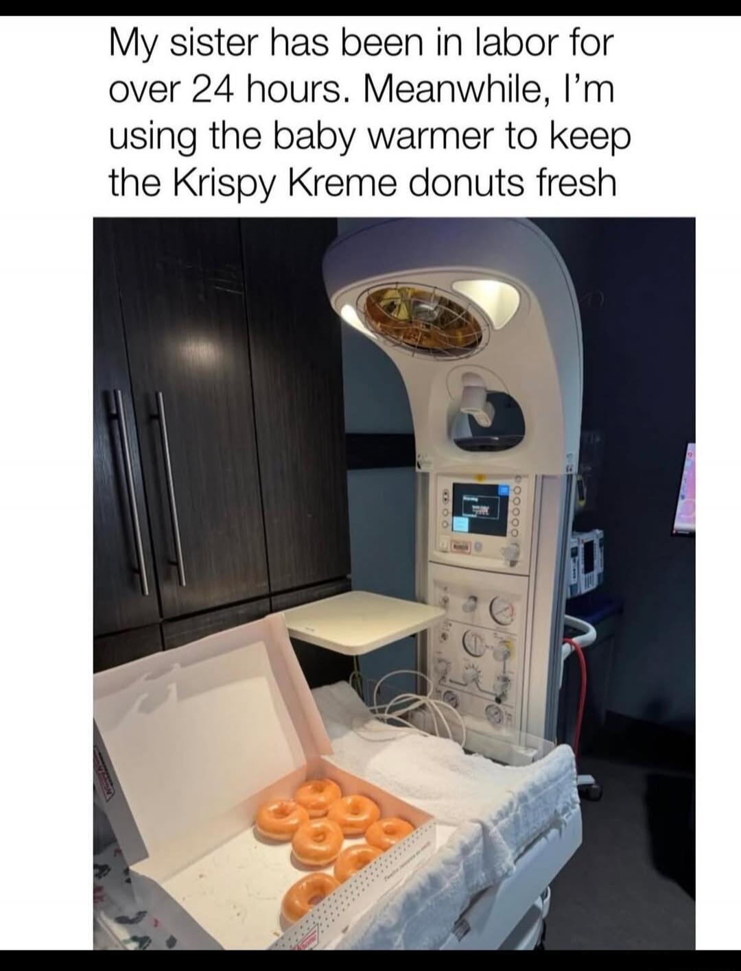 My sister has been in labor for over 24 hours. Meanwhile, I'm using the baby warmer to keep the Krispy Kreme donuts fresh