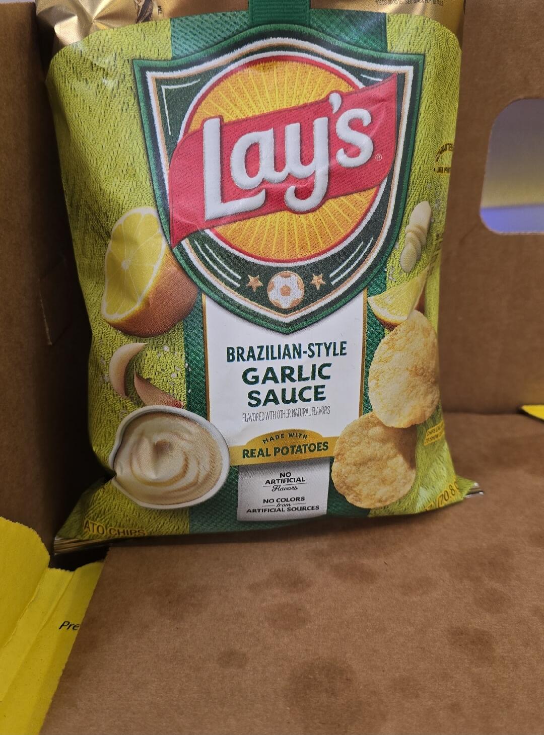 Lay's BRAZILIAN-STYLE GARLIC SAUCE FLAVORED WITH OTHER NATURAL FLAVORS MADE WITH REAL POTATOES NO ARTIFICIAL Flavors NO COLORS from ARTIFICIAL SOURCES ATO CHIPS