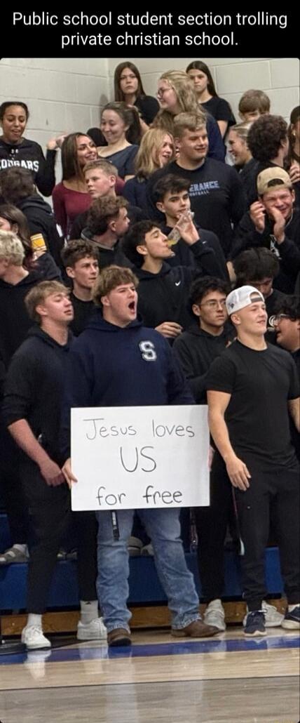 Public school student section trolling private christian school. Jesus loves US for free