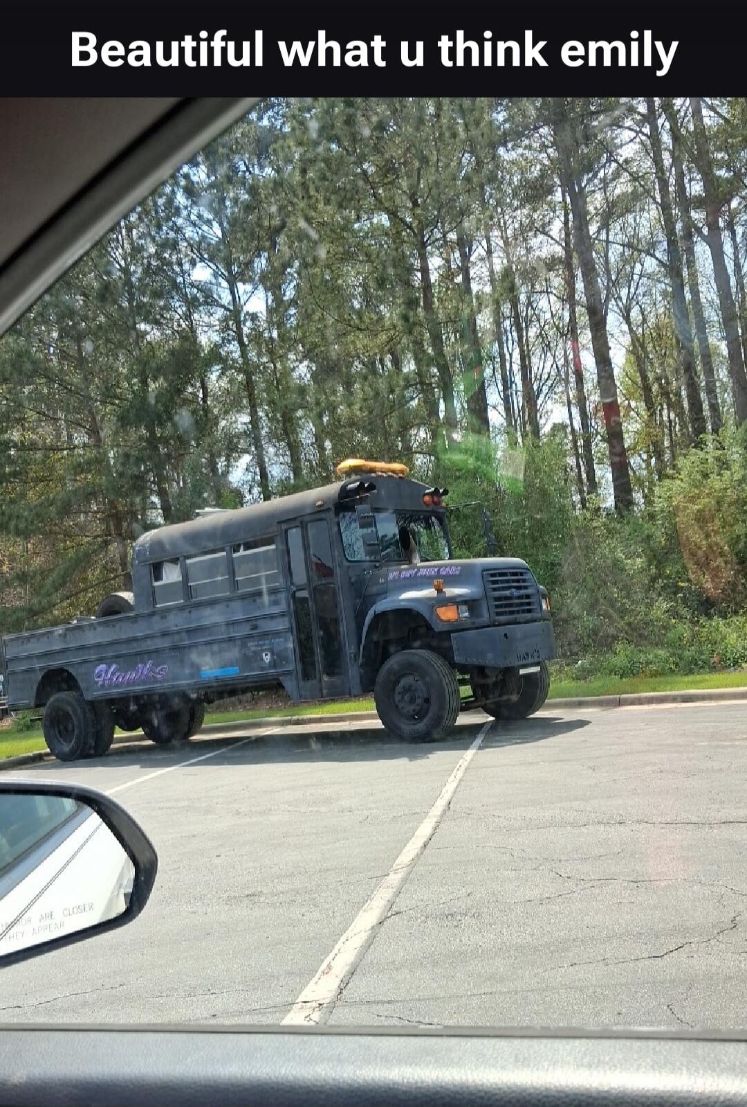 Beautiful what u think emily. On the side of the bus, it says 'Hawks' and 'WE DONT GIVE GARS'. On the front bumper, 'HAWK'S'.