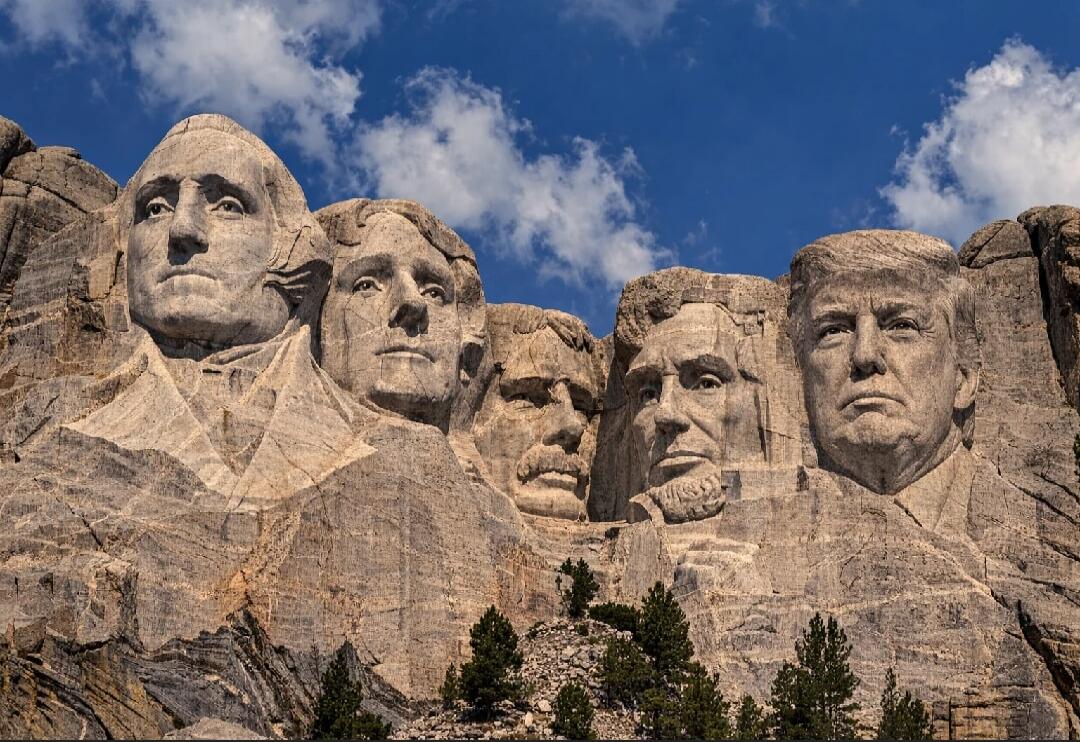 Mount Rushmore National Memorial is centered on a colossal sculpture carved into the granite face of Mount Rushmore in the Black Hills of South Dakota. The sculpture features the 60-foot (18 m) heads of four U.S. presidents: George Washington, Thomas Jefferson, Theodore Roosevelt, and Abraham Lincoln. The memorial park covers 1,278.45 acres (5.17 k