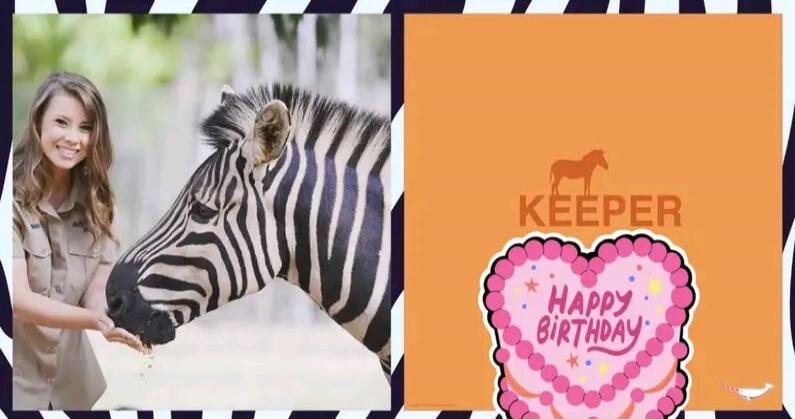 A woman feeding a zebra. Text on screen: KEEPER, HAPPY BIRTHDAY.