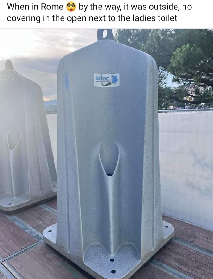 When in Rome 82 by the way it was outside no covering in the open next to the ladies toilet