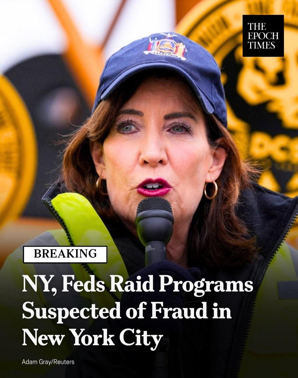 BREAKING NY, Feds Raid Programs Suspected of Fraud in New York City. Image shows a woman speaking into a microphone, wearing a cap with 'EXCELSIOR' and a high-visibility vest. The Epoch Times logo is visible.