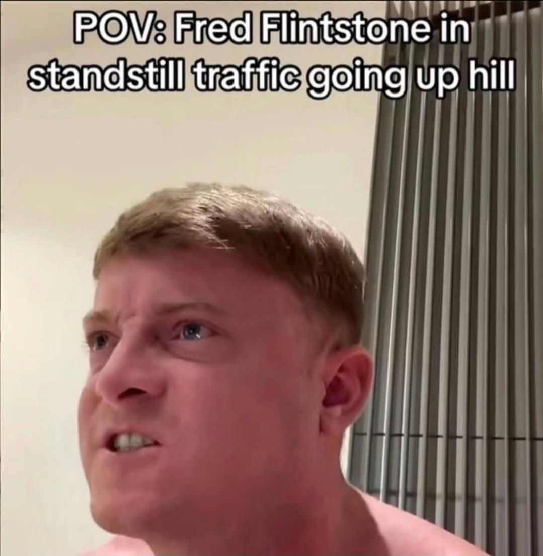 POV: Fred Flintstone in standstill traffic going up hill