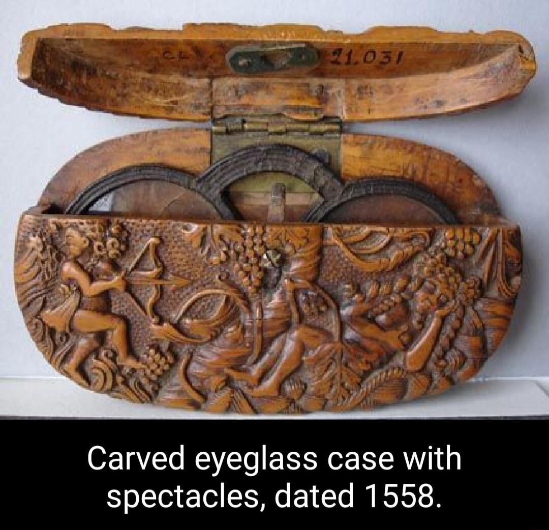Carved eyeglass case with spectacles dated 1558