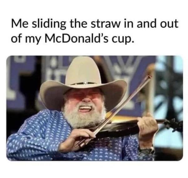 Me sliding the straw in and out of my McDonalds cup