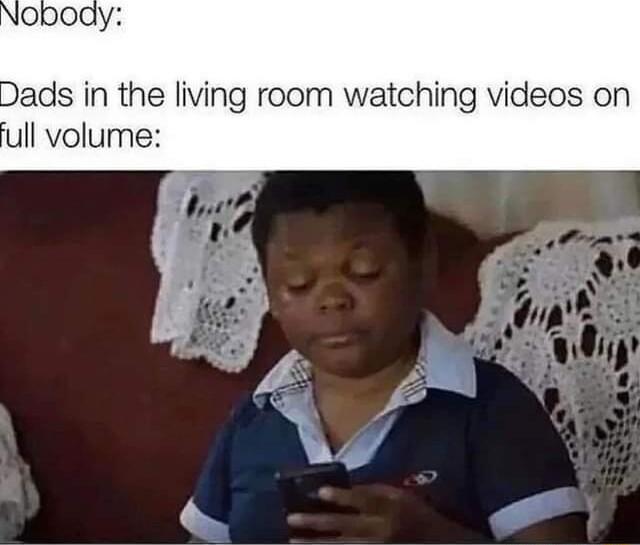 Dads in the living room watching videos on ull volume