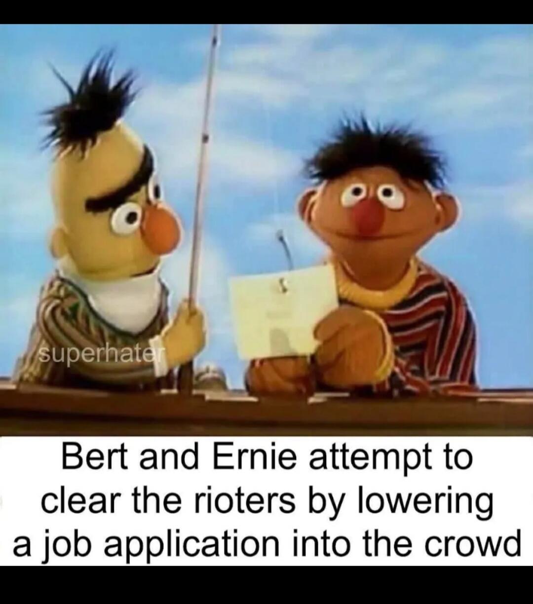 superhater Bert and Ernie attempt to clear the rioters by lowering a job application into the crowd