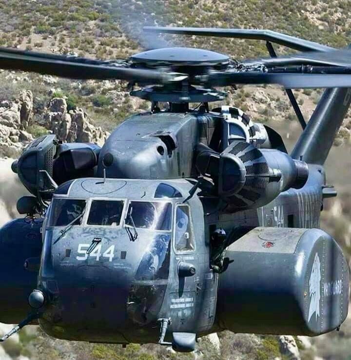 A military twin-rotor helicopter with grey camouflage and the number 544 on the nose.