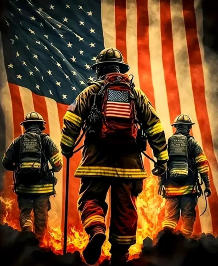 Three firefighters with gear standing in front of a waving American flag, flames behind them.