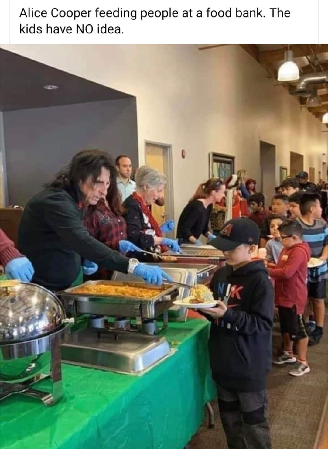 Alice Cooper feeding people at a food bank The kids have NO idea