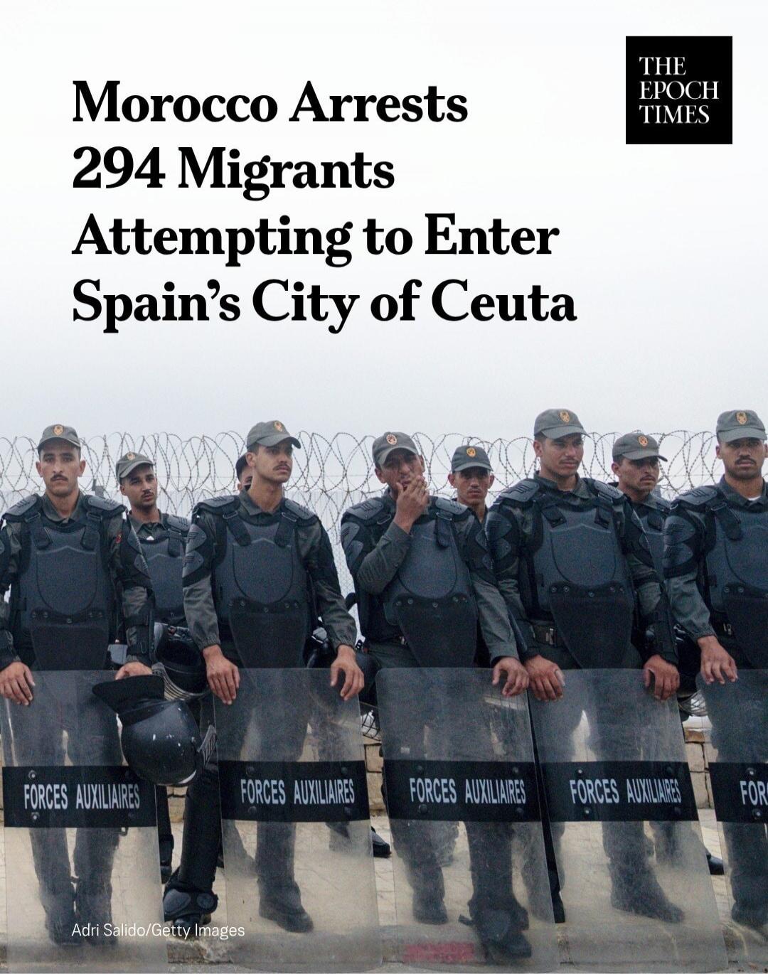 Morocco Arrests 294 Migrants Attempting to Enter Spain's City of Ceuta. THE EPOCH TIMES. FORCES AUXILIAIRES. Adri Salido/Getty Images.