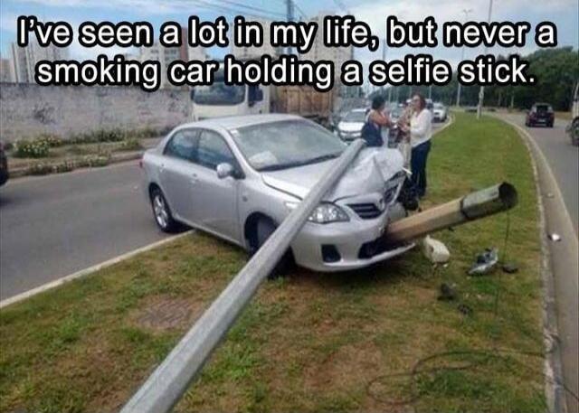 I've seen a lot in my life, but never a smoking car holding a selfie stick.