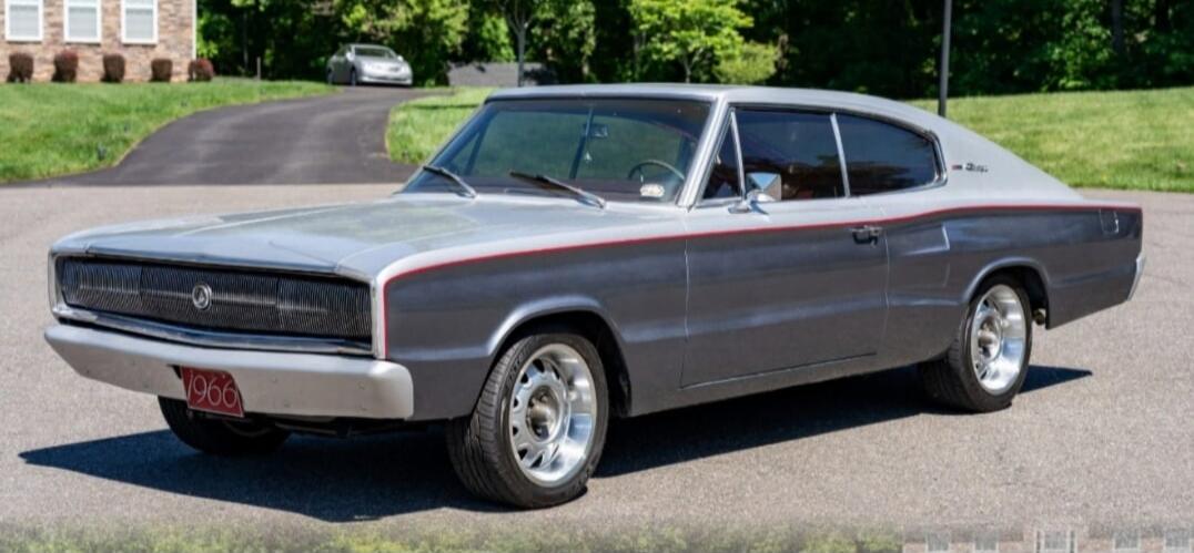The license plate displays the year 1966. A classic 1966 Dodge Charger is shown.