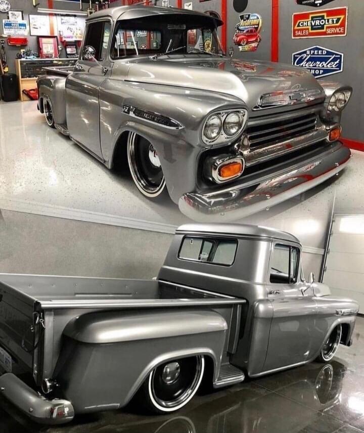 CHEVROLET SALES SERVICE SPEED CHEVROLET SHOP Autorama. A custom-built classic grey Chevrolet pickup truck with a lowered suspension and custom wheels.
