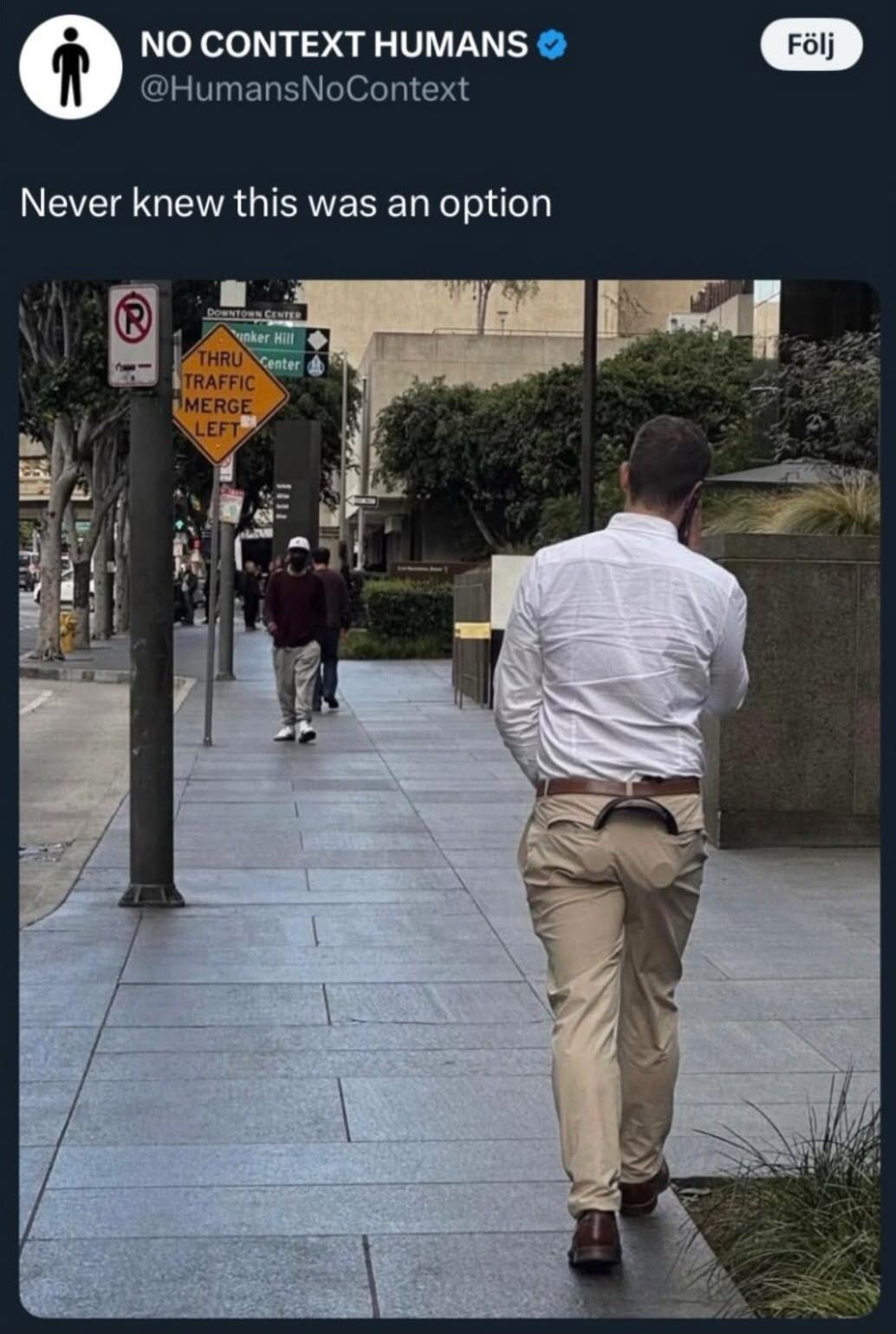 NO CONTEXT HUMANS @HumansNoContext Never knew this was an option. Street signs visible: DOWNTOWN CENTER, Bunker Hill, THRU TRAFFIC MERGE LEFT.
