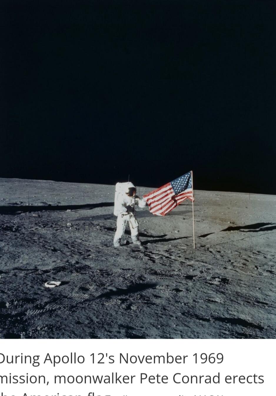 During Apollo 12's November 1969 mission, moonwalker Pete Conrad erects the American flag.