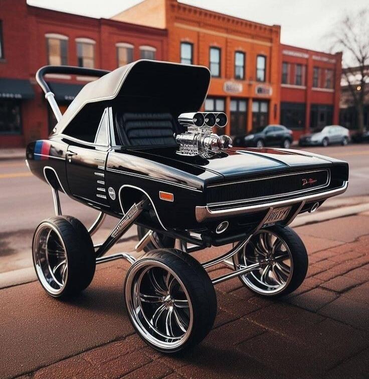 Dodge Charger style baby stroller with supercharger and custom wheels. License plate reads BABY1.