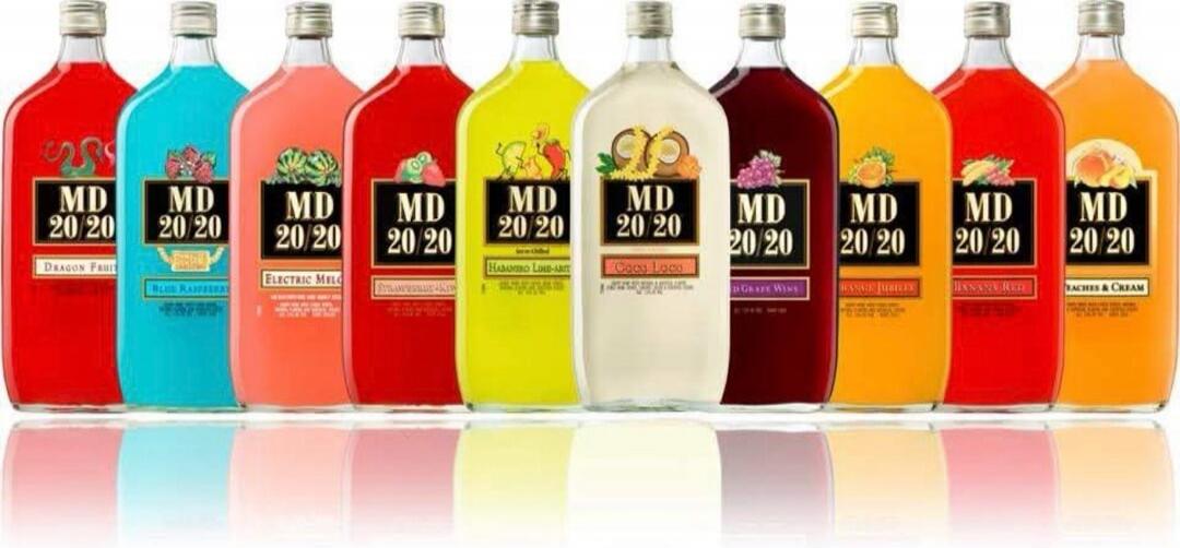 MD 20/20 Dragon Fruit, Blue Raspberry, Electric Melon, Strawberry-Kiwi, Habanero Lime-Art, Coco Loco, Red Grape Wine, Orange Jubilee, Banana Red, Peaches & Cream. A variety of colorful MD 20/20 fortified wine bottles are displayed in a row.