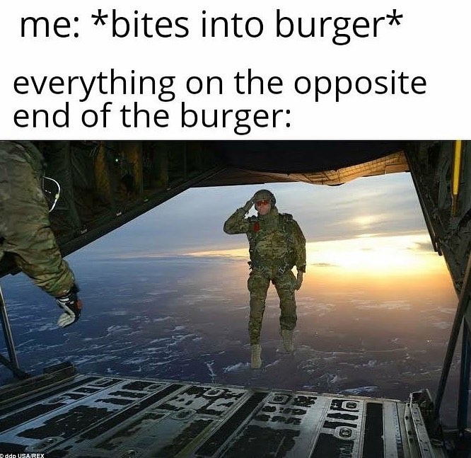 me bites into burger everything on the opposite end of the burger