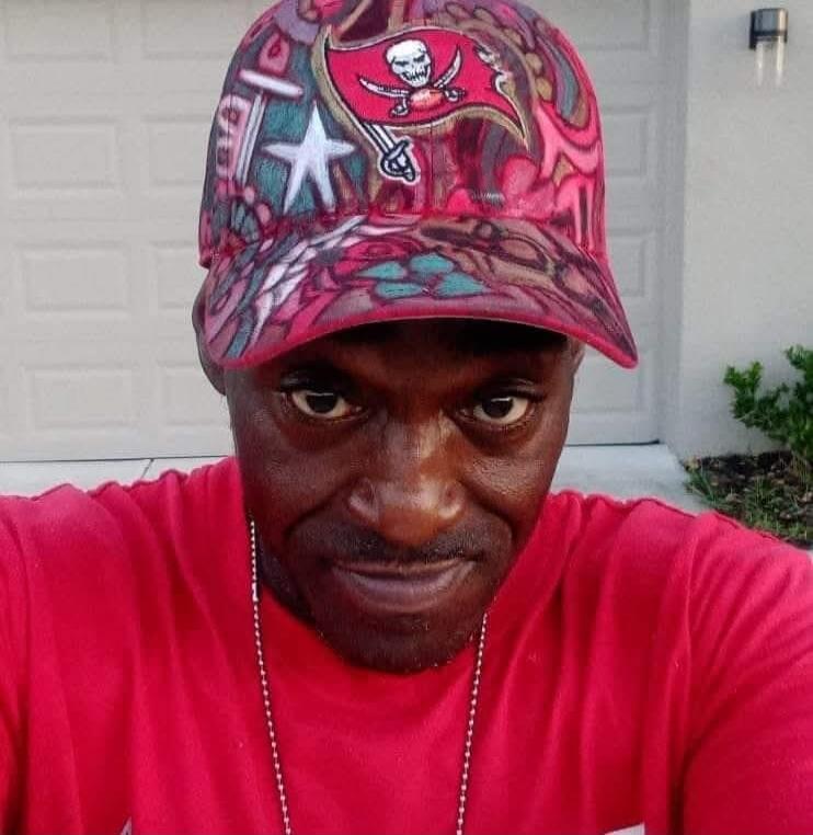 Tampa Bay Buccaneers logo on cap.