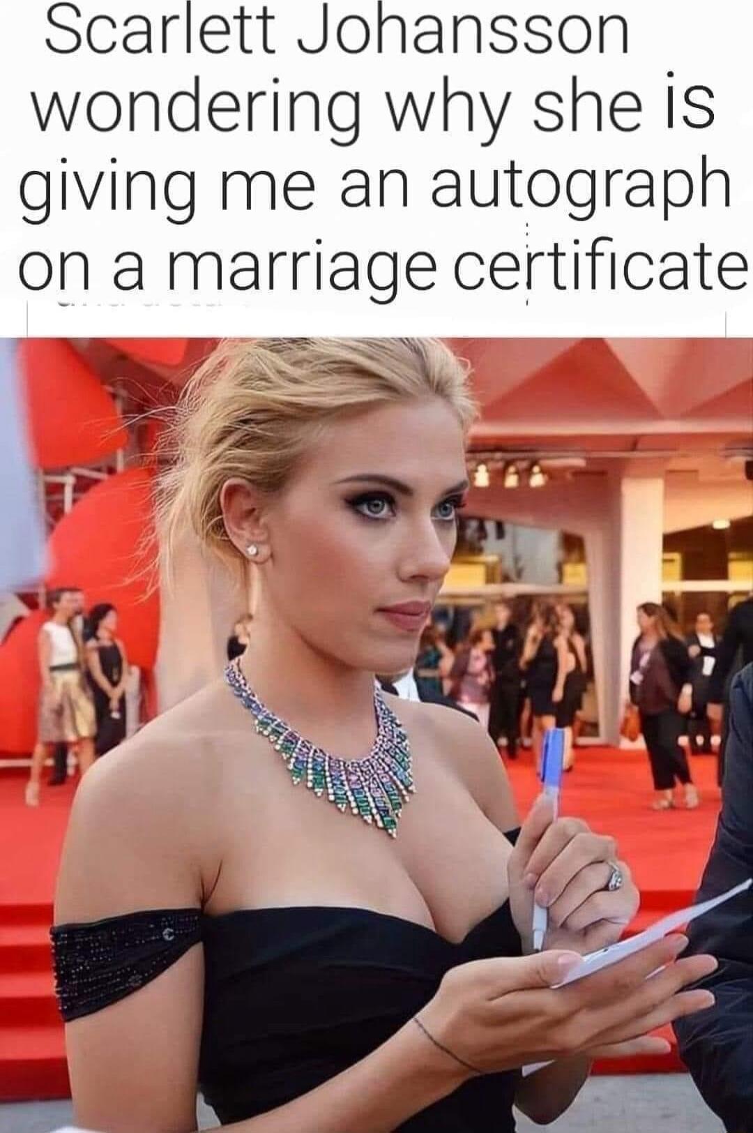 Scarlett Jonansson wondering why she is giving me an autograph on a marriage certificate