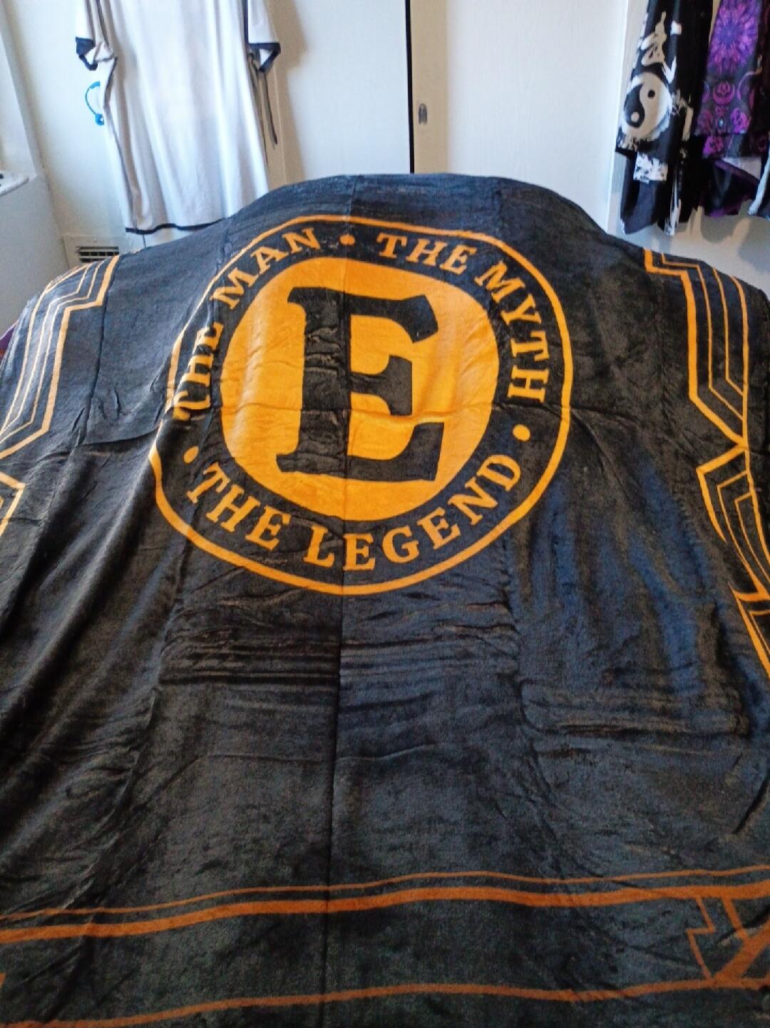 E (center) The Man • The Myth • The Legend around the circle. Session ID: 1060007.