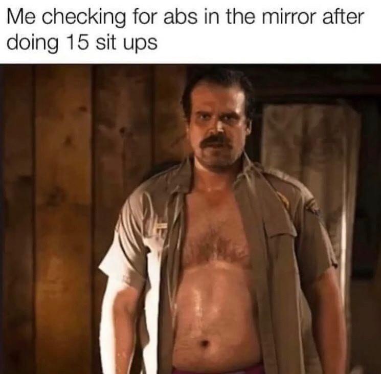 Me checking for abs in the mirror after doing 15 sit ups
