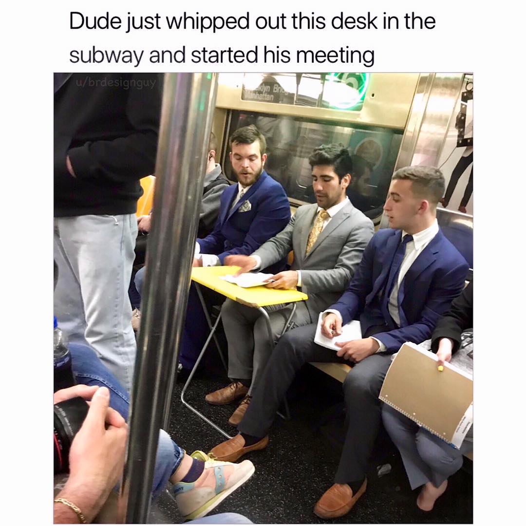 Dude just whipped out this desk in the subway and started his meeting
