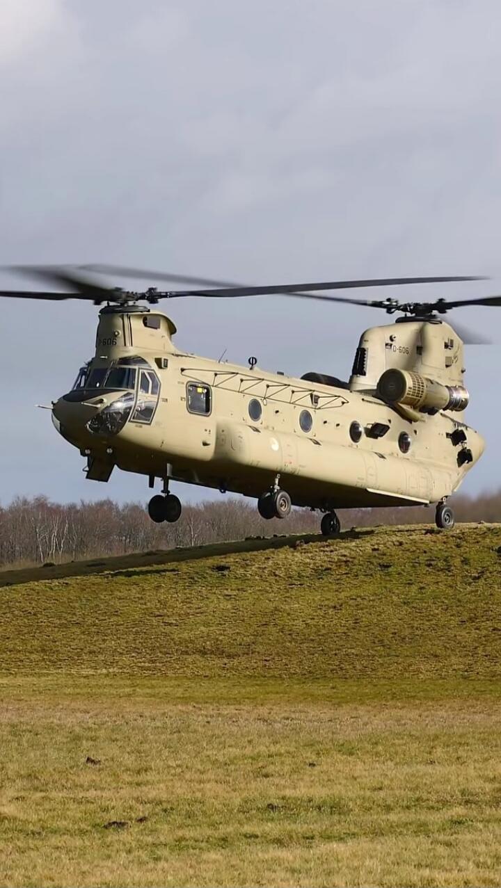The helicopter is a Boeing CH-47 Chinook, a heavy-lift tandem-rotor helicopter.