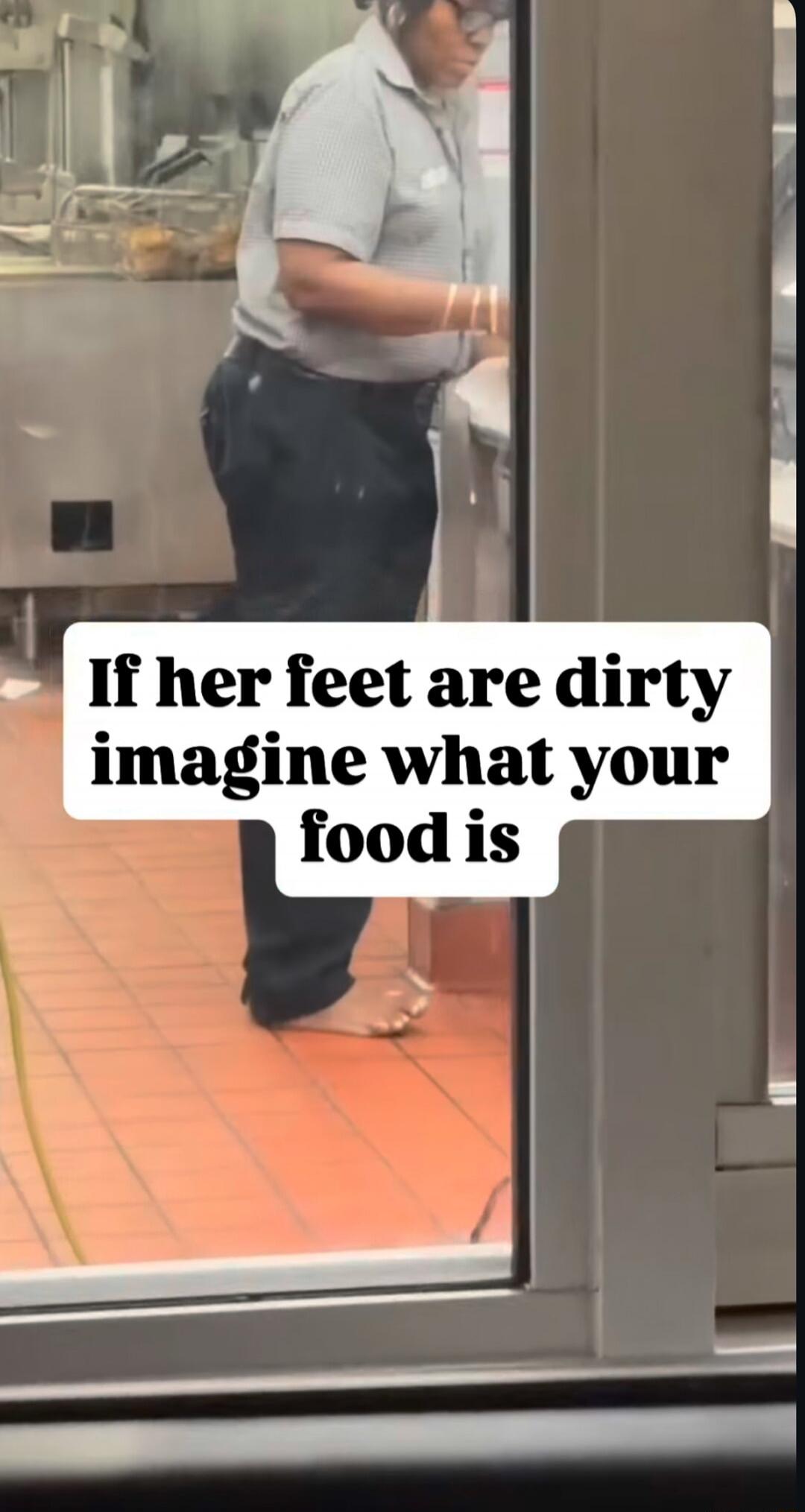 A person working in a kitchen environment is seen barefoot with visibly dirty feet. The overlay text reads: 