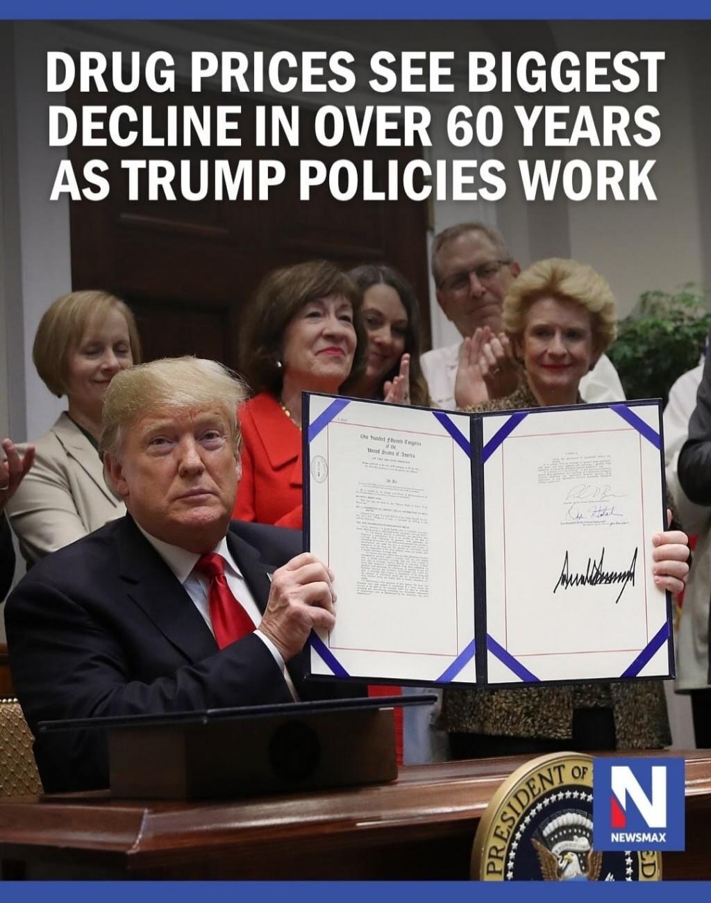 DRUG PRICES SEE BIGGEST DECLINE IN OVER 60 YEARS AS TRUMP POLICIES WORK. Donald Trump holds up a signed document, surrounded by people, with the Newsmax logo visible.