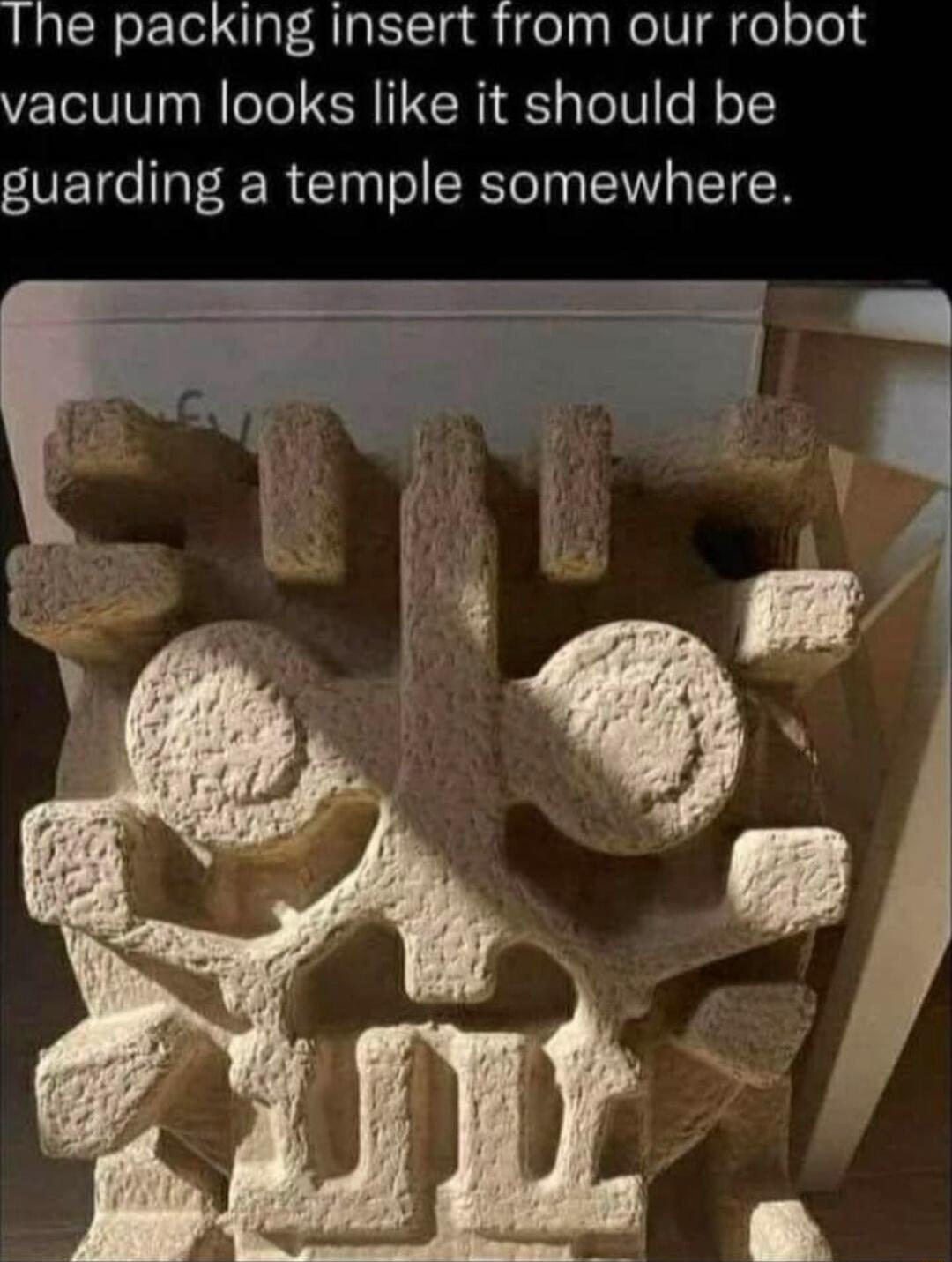 The packing insert from our robot vacuum looks like it should be guarding a temple somewhere