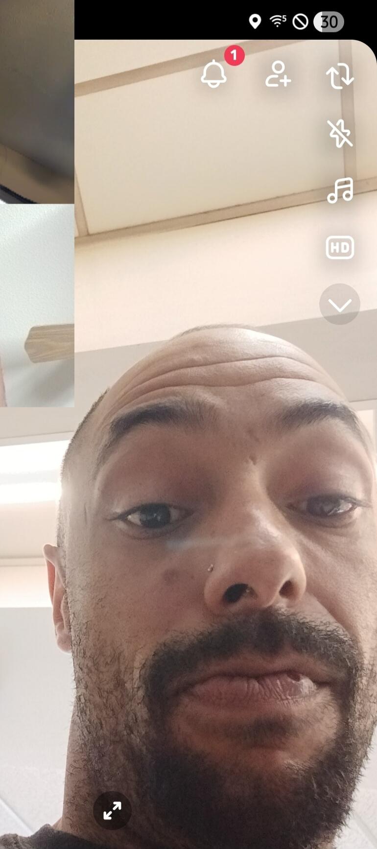 A man's face in a close-up selfie.