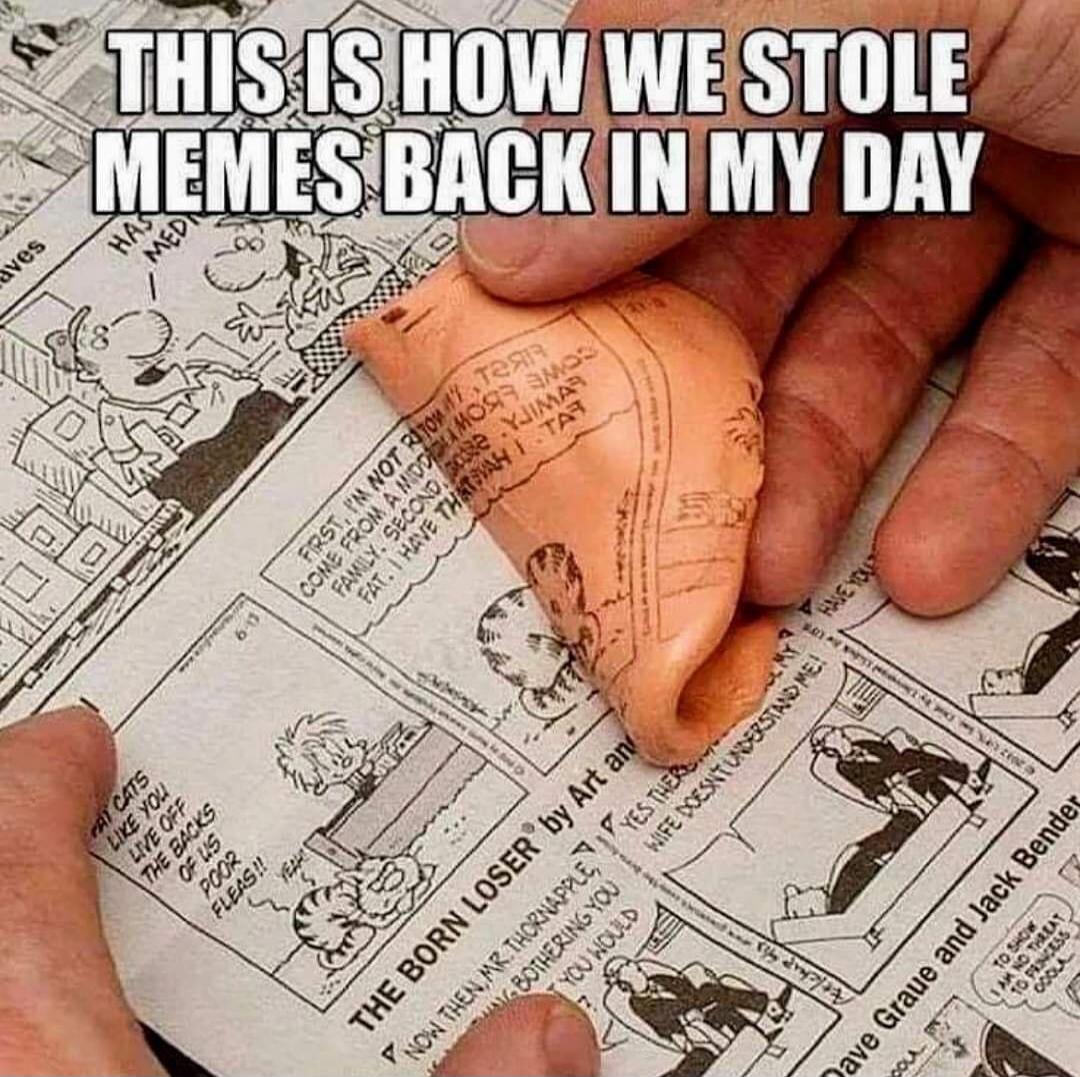 THIS IS HOW WE STOLE MEMES BACK IN MY DAY. The image shows a hand using a putty-like substance, similar to Silly Putty, to copy a comic strip from a newspaper. Visible text from the comic includes phrases like 'FAT CATS LIKE YOU LIVE OFF THE BACKS OF US POOR FLEAS!!' and 'THE BORN LOSER® by Art an'.