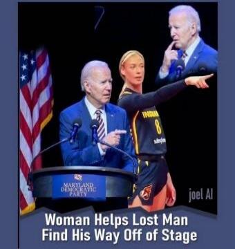 Woman Helps Lost Man Find His Way Off Of Stage. Maryland Democratic Party.