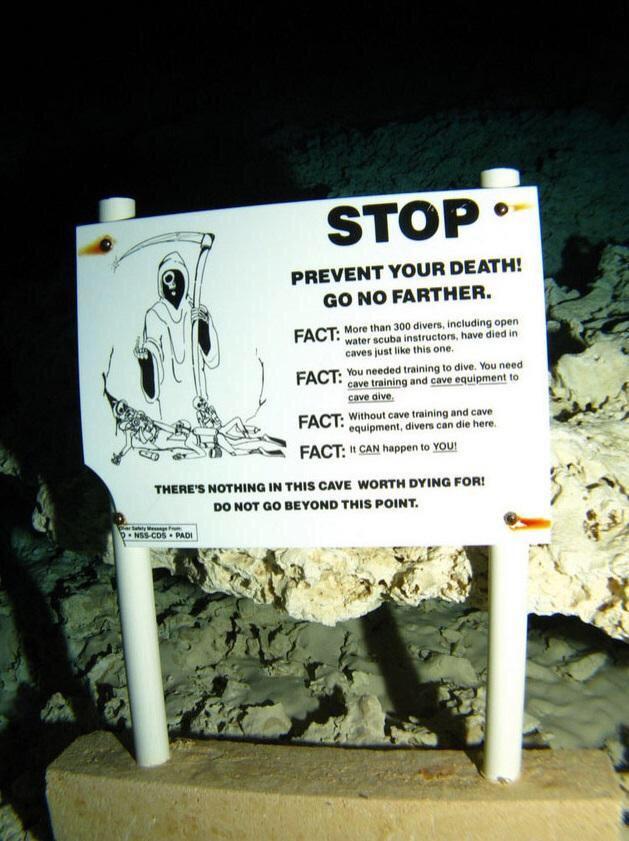 STOP PREVENT YOUR DEATH GONO FARTHER FACT o e e s noaded tining o dive You 10ed e raining and cave equipment 10 ut cave training and cave THERES NOTHING IN THIS CAVE WORTH DYING FOR DO NOT GO BEYOND THIS POINT