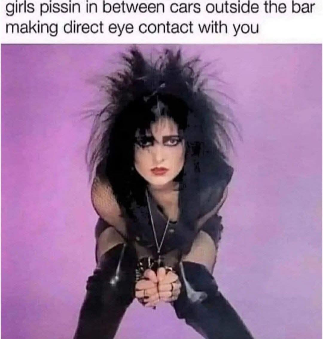 girls pissin in between cars outside the bar making direct eye contact with you