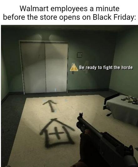 Walmart employees a minute fore the store opens on Black Friday ABe ready to fight the horde