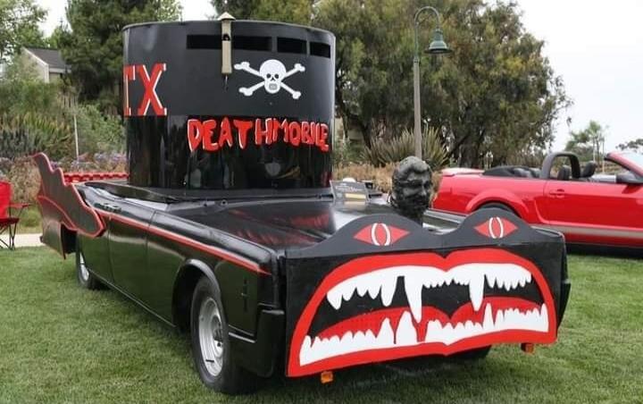 IX DEATHMOBILE. A custom car with a skull and crossbones emblem and a large mouth with fangs at the rear.