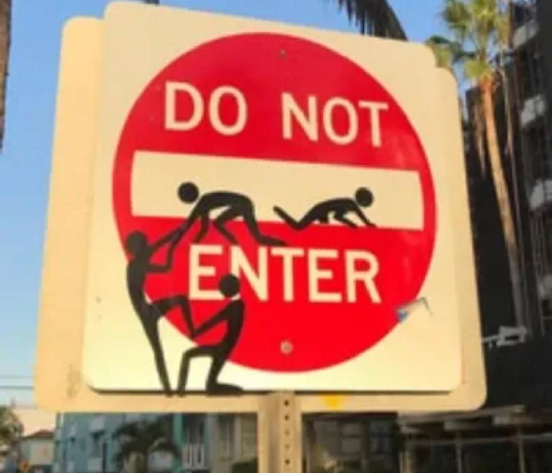 DO NOT ENTER sign with stick figures depicting sexual acts.