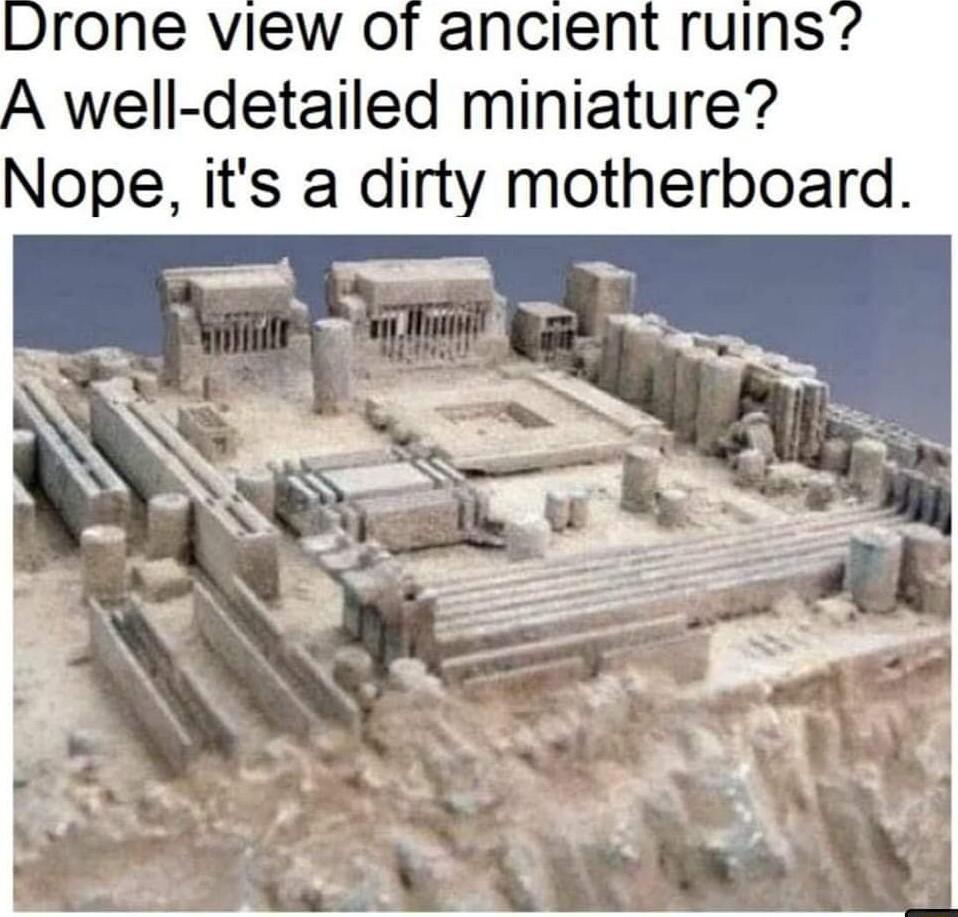 Drone view of ancient ruins A well detailed miniature Nope its a dirty motherboard